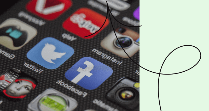 A cell phone with a Facebook icon on the screen.