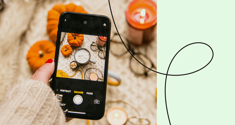 A cell phone with a picture of pumpkins on it.