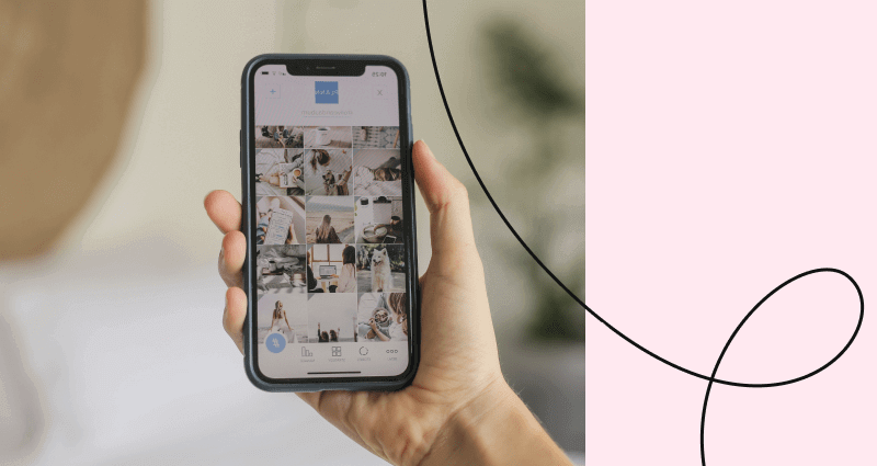 A person holding a cell phone with a picture of a woman on it.