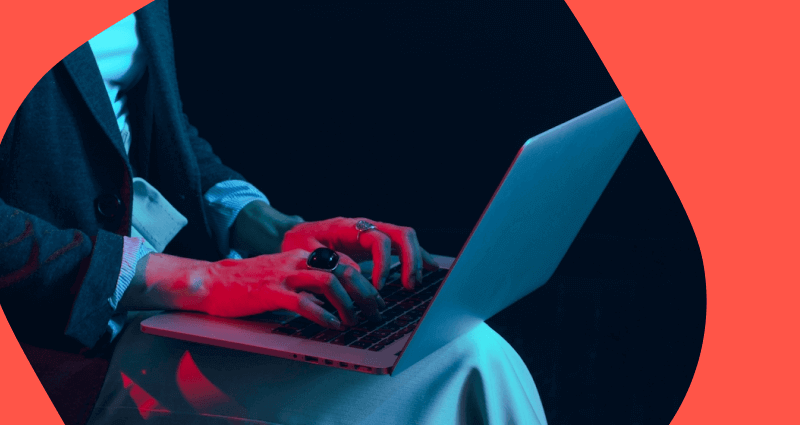 A person is typing on a laptop computer.