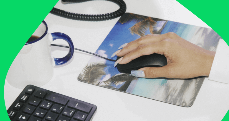 A person is using a computer mouse on a mouse pad.