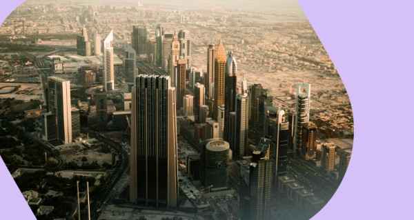 A view of a city from above with a purple border.