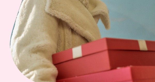 Person writing in note book