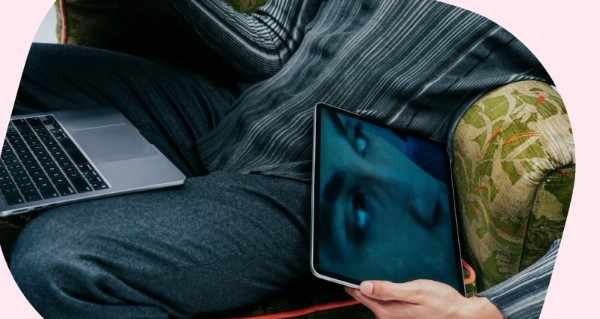 Person writing in note book