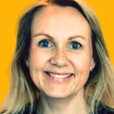 Smiling middle-aged woman with blonde hair against a yellow background.