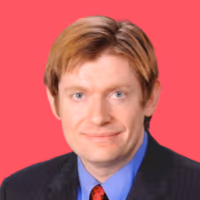 Portrait of a man with light brown hair wearing a dark suit, blue shirt, and red tie against a pink background.