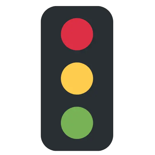 Traffic light with red, yellow, and green lights from top to bottom.