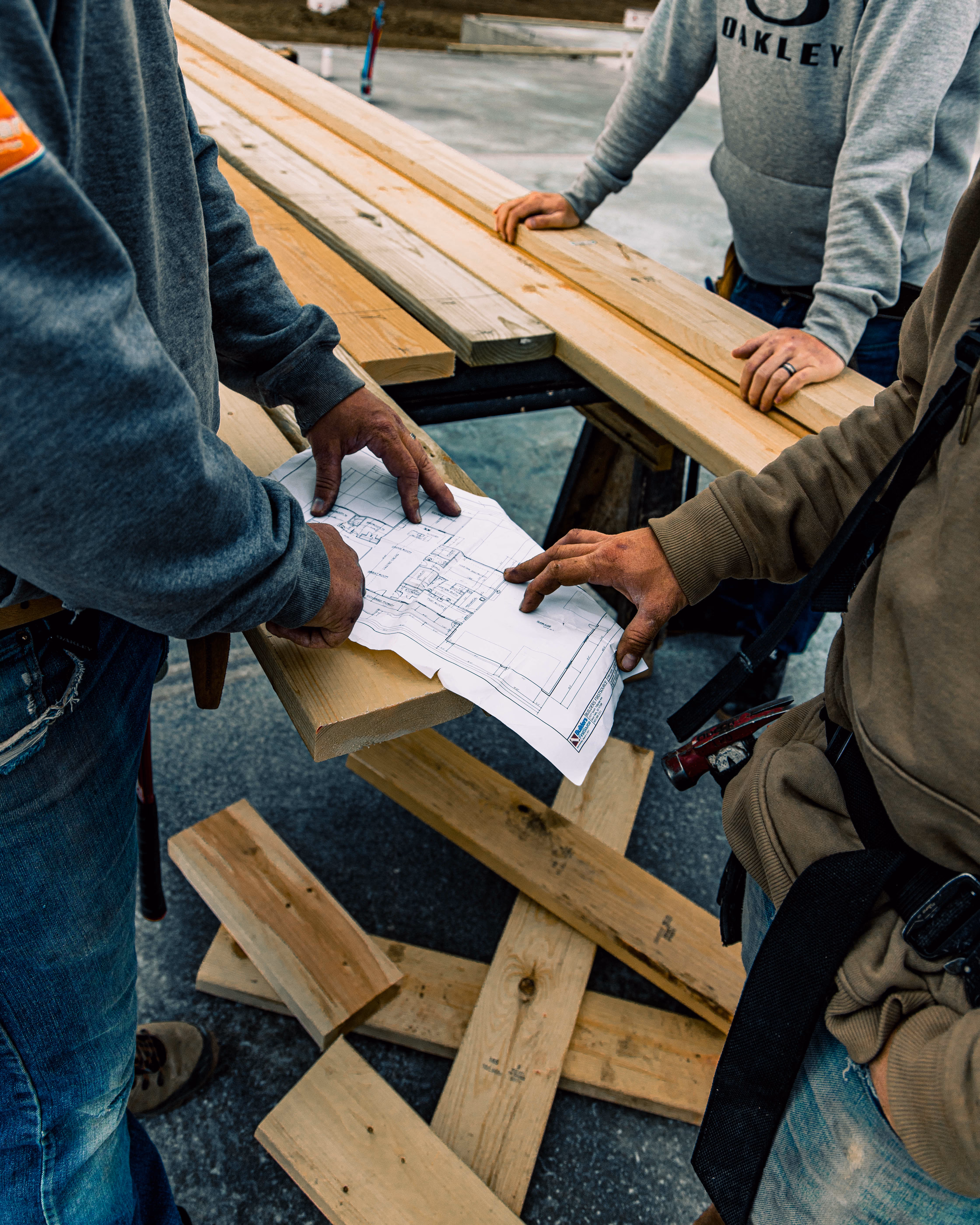 OdeCo framers reviewing a floor plan for a new home in Sioux Falls, SD.