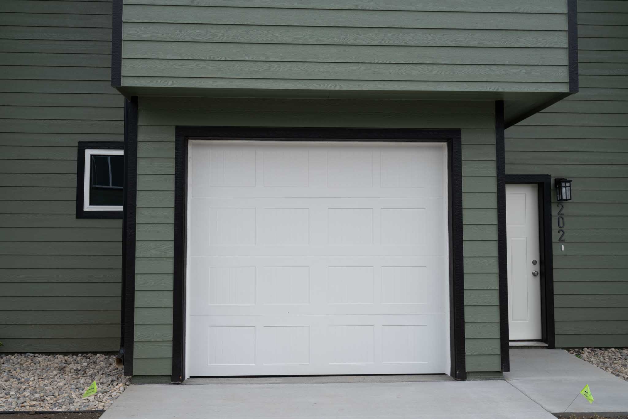 White garage door with black trim.