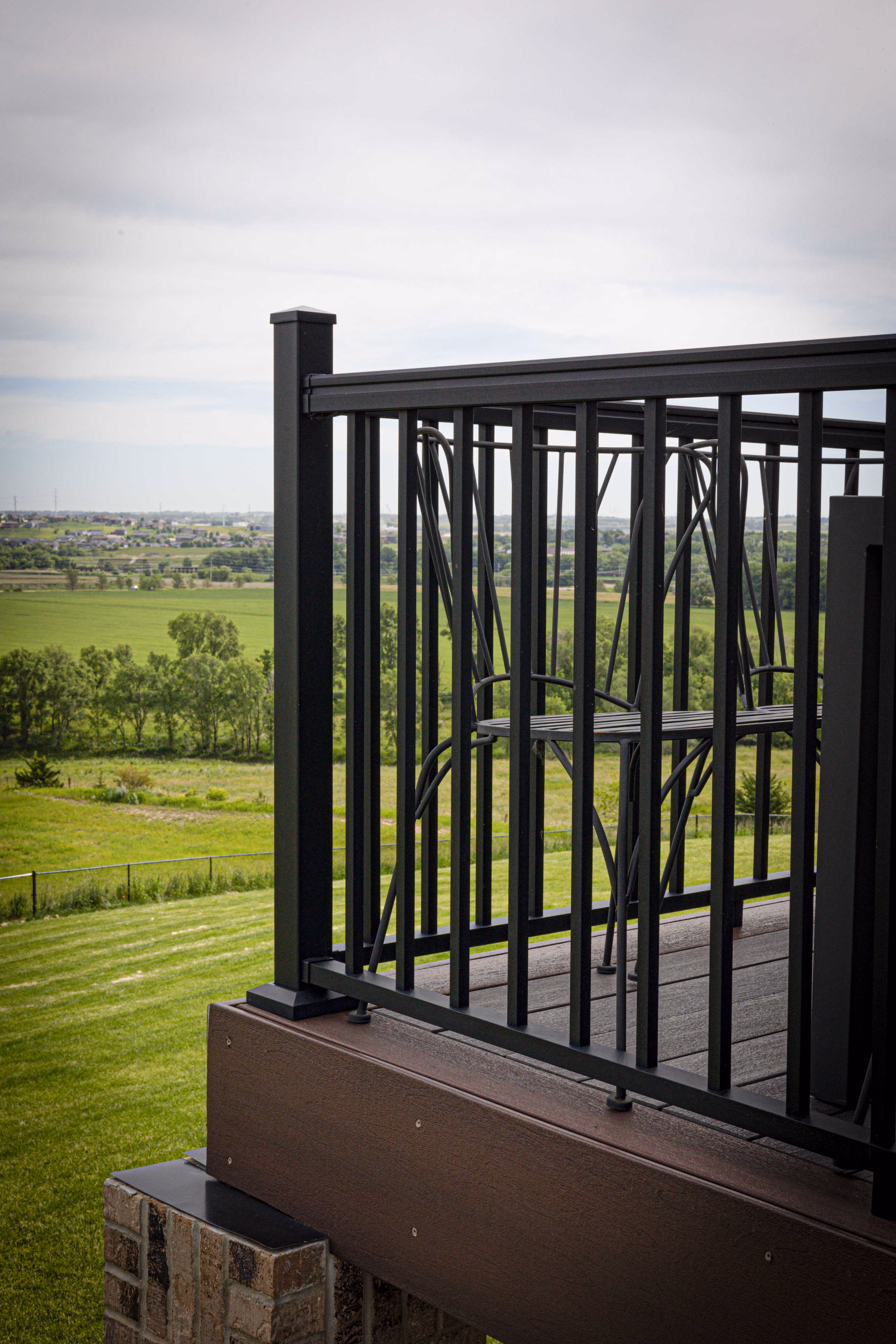 Brown composite deck with black metal railings - Brandon, SD