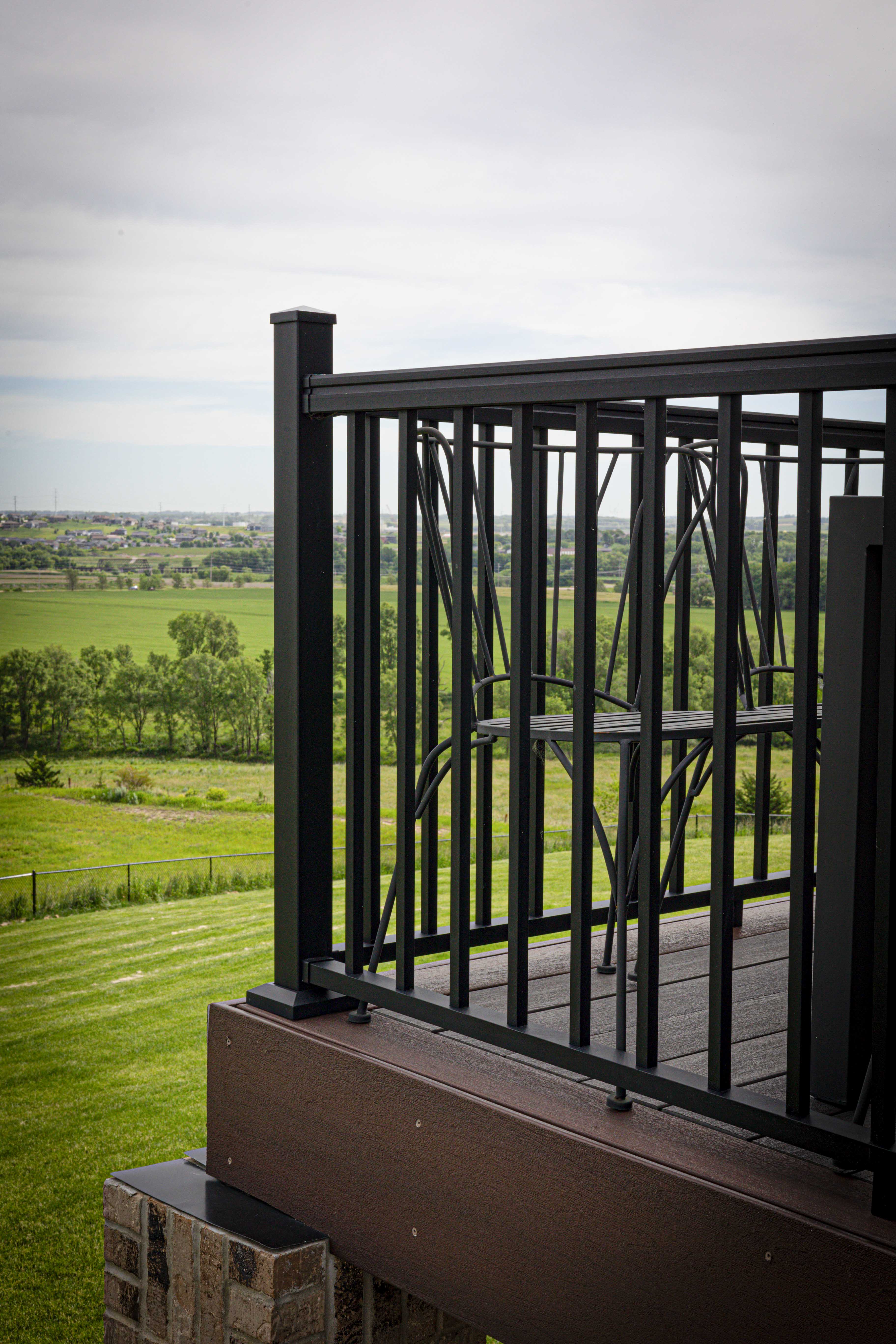 Brown composite deck with black metal railings - Brandon, SD