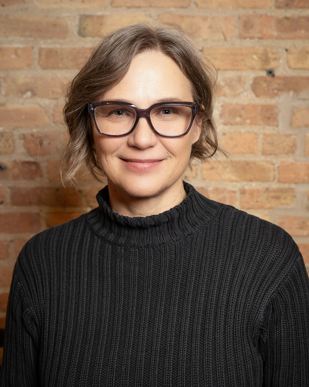 Krista Varsbergs headshot who is a female therapist in Naperviile and is an experienced counselor specializing in helping clients aged 16+ with emotional regulation, life transitions, ADHD, depression, anxiety, and more.