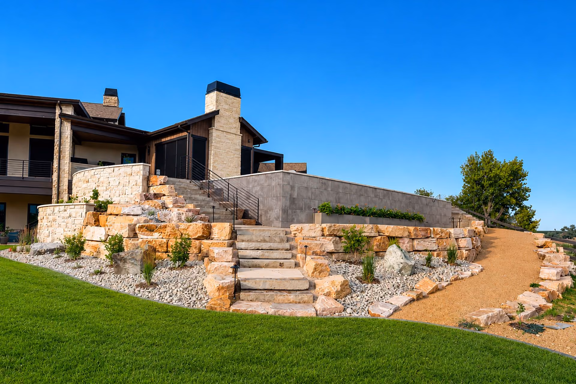 Custom retaining wall and paver patio installation by Belmire Premier Landscape Solutions in Loveland Colorado