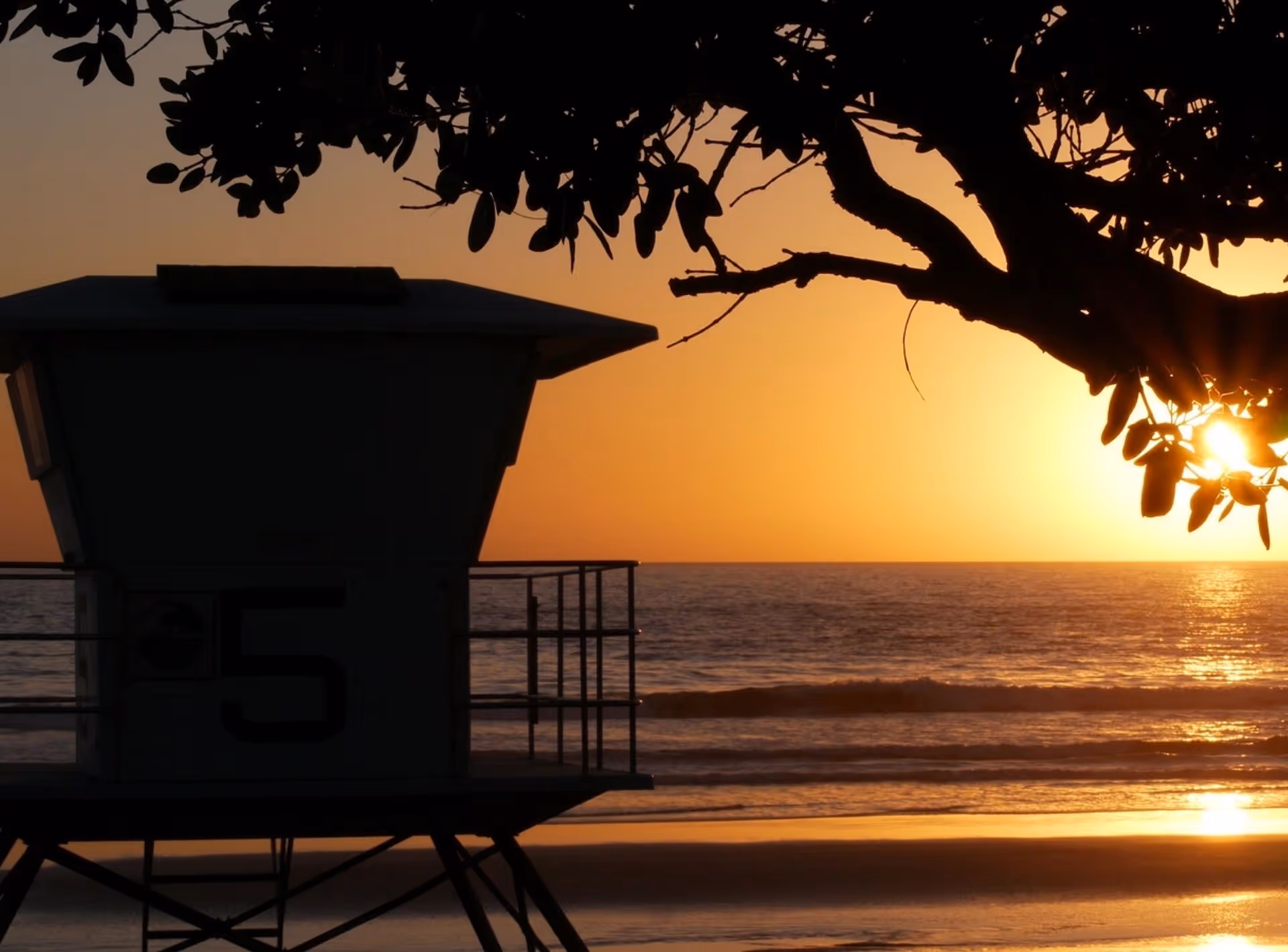 Lifeguard tower at sunset