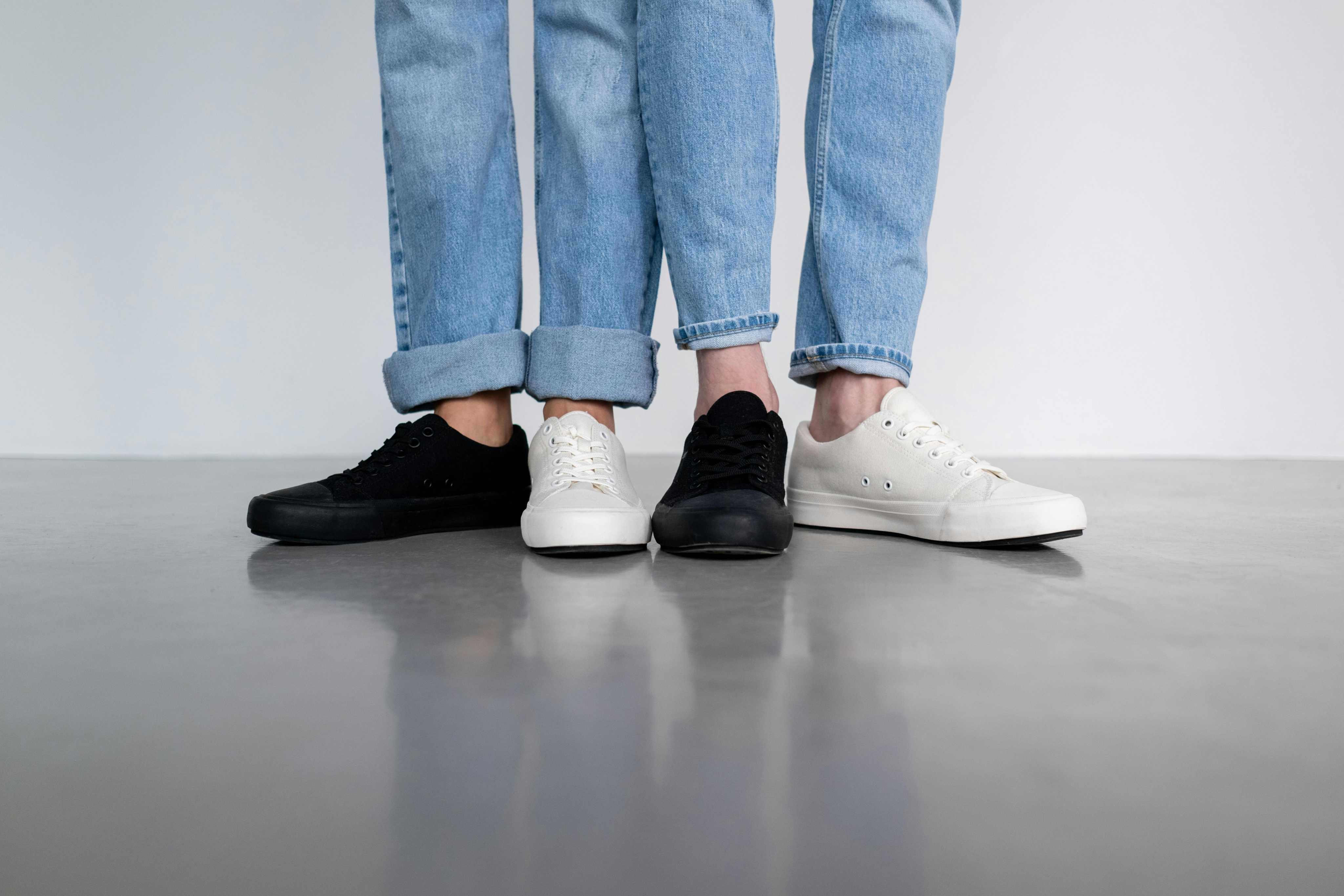 People Wearing White and Black Sneakers