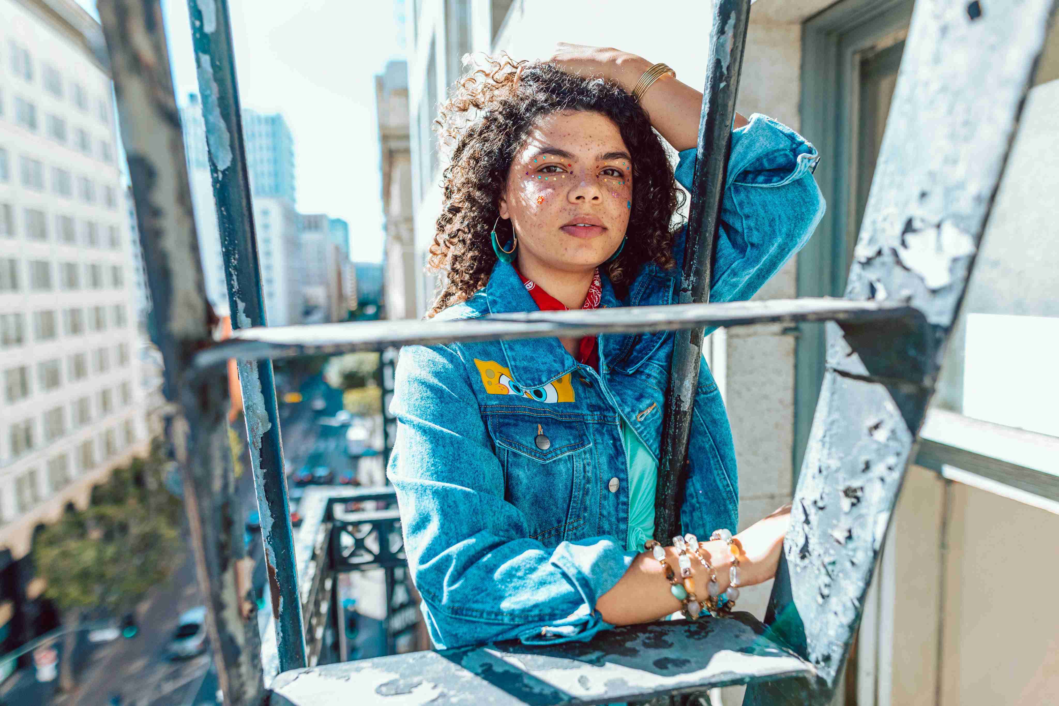 Girl Standing on Ladder Wearing Denim Jacket