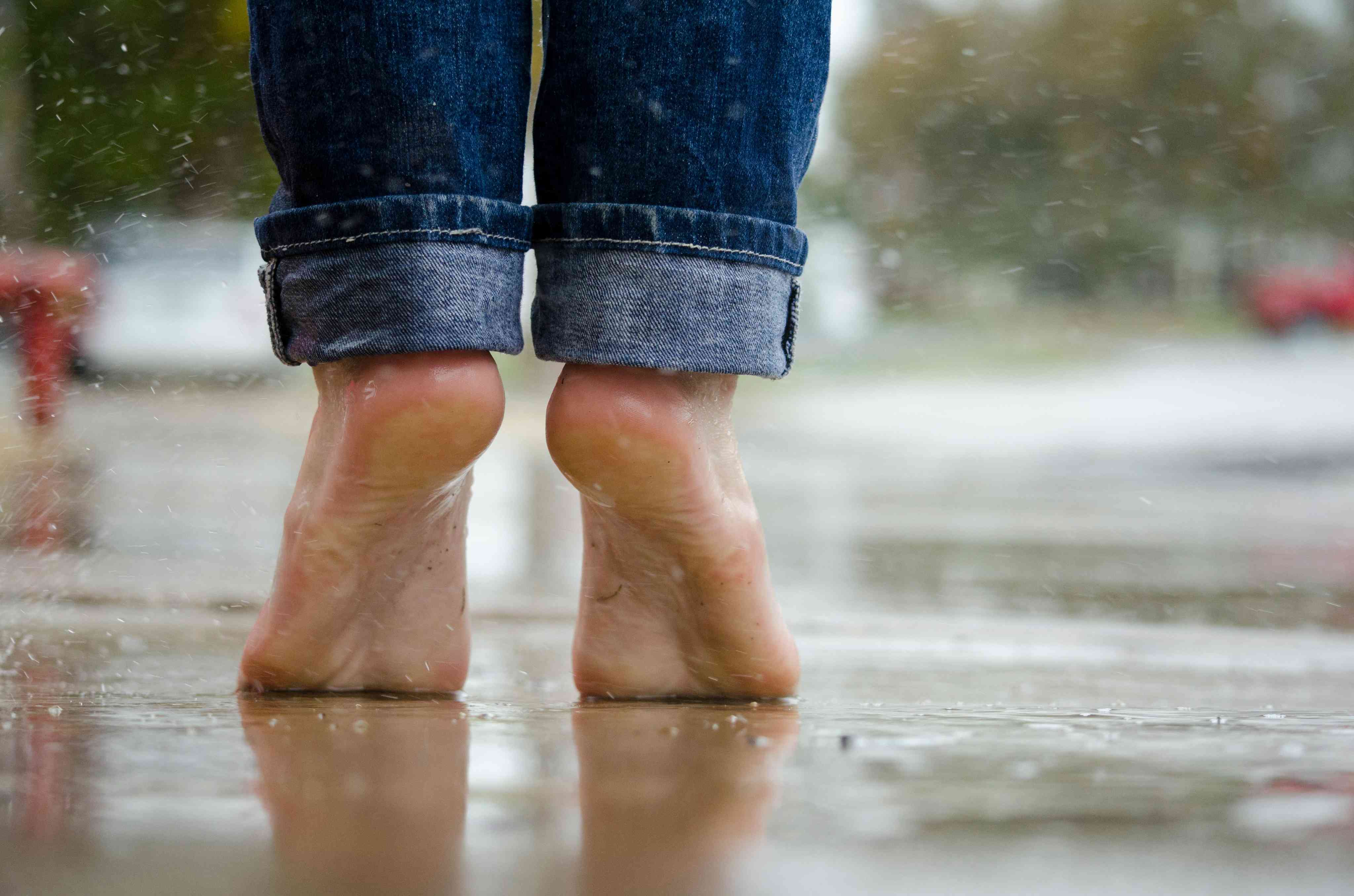 Person in Blue Denim Jeans Standing Outside the Rain More info Share
