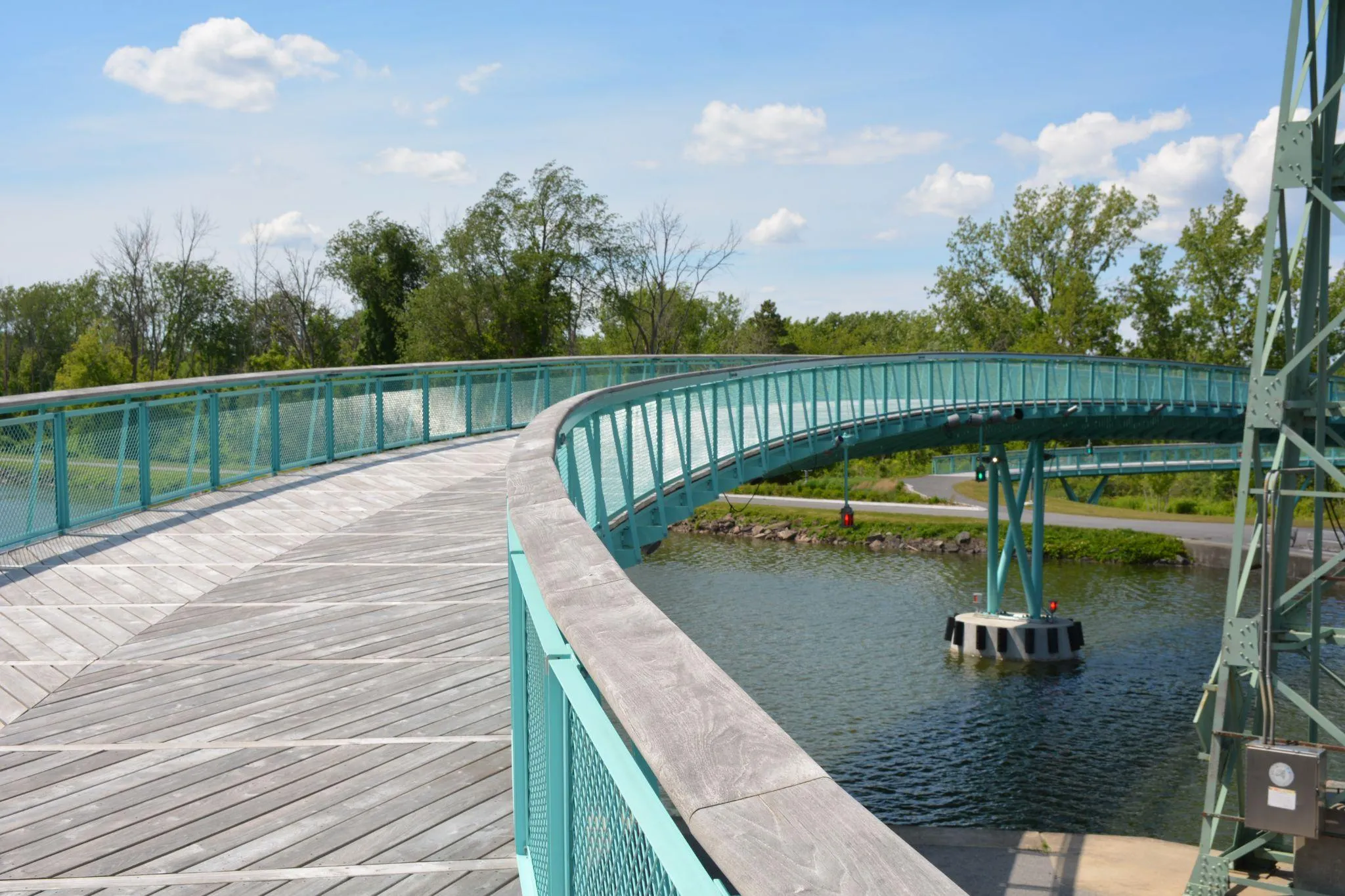 Curved pedestrian bridge over water