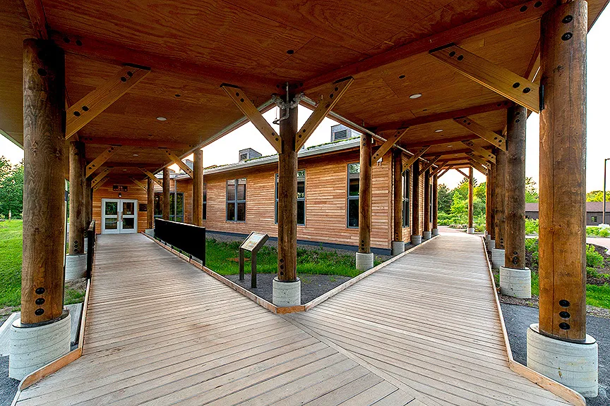 Covered wooden walkway outside a building
