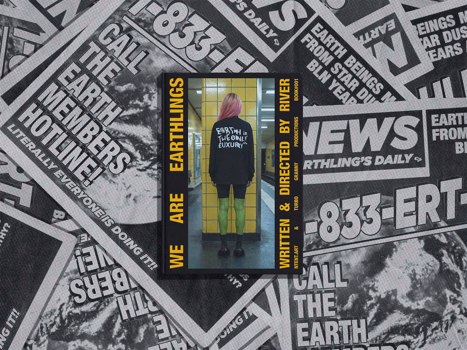 Book cover titled 'We Are Earthlings' featuring a person with pink hair facing a yellow tiled wall, wearing a black shirt that says 'Earth is the Only Luxury'.