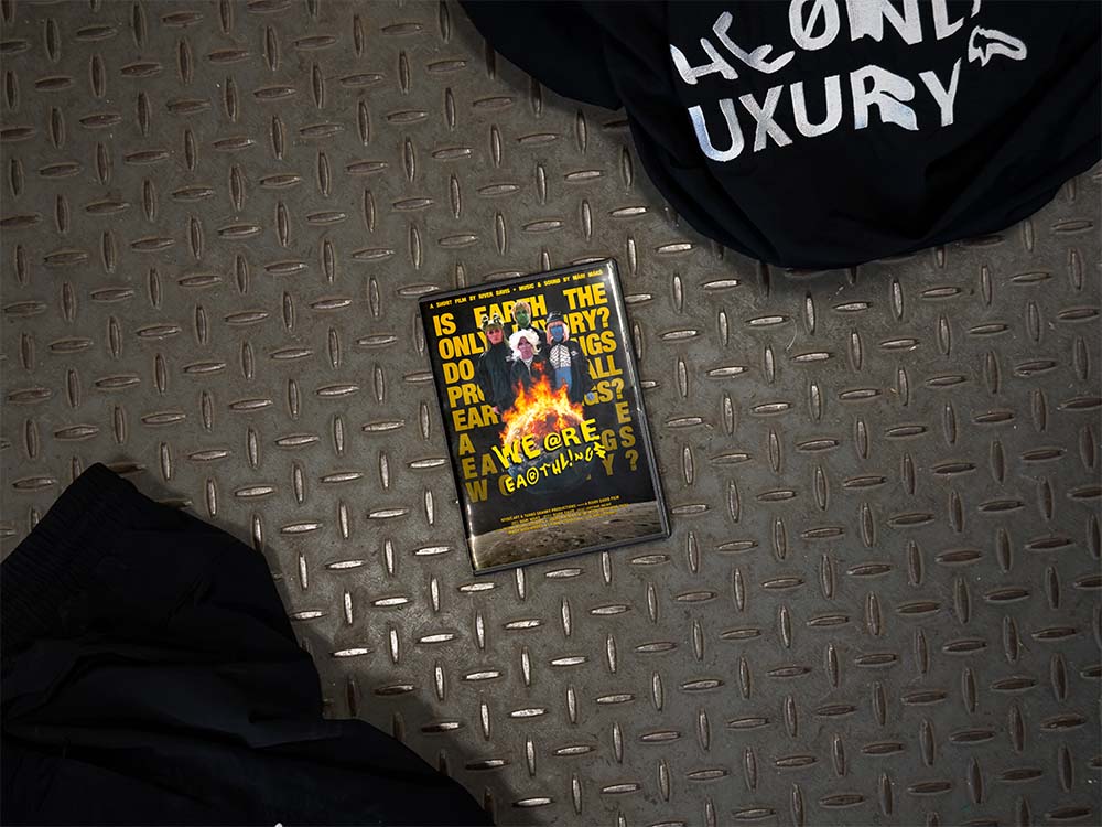 Photograph of a bridge underpass with paste up posters