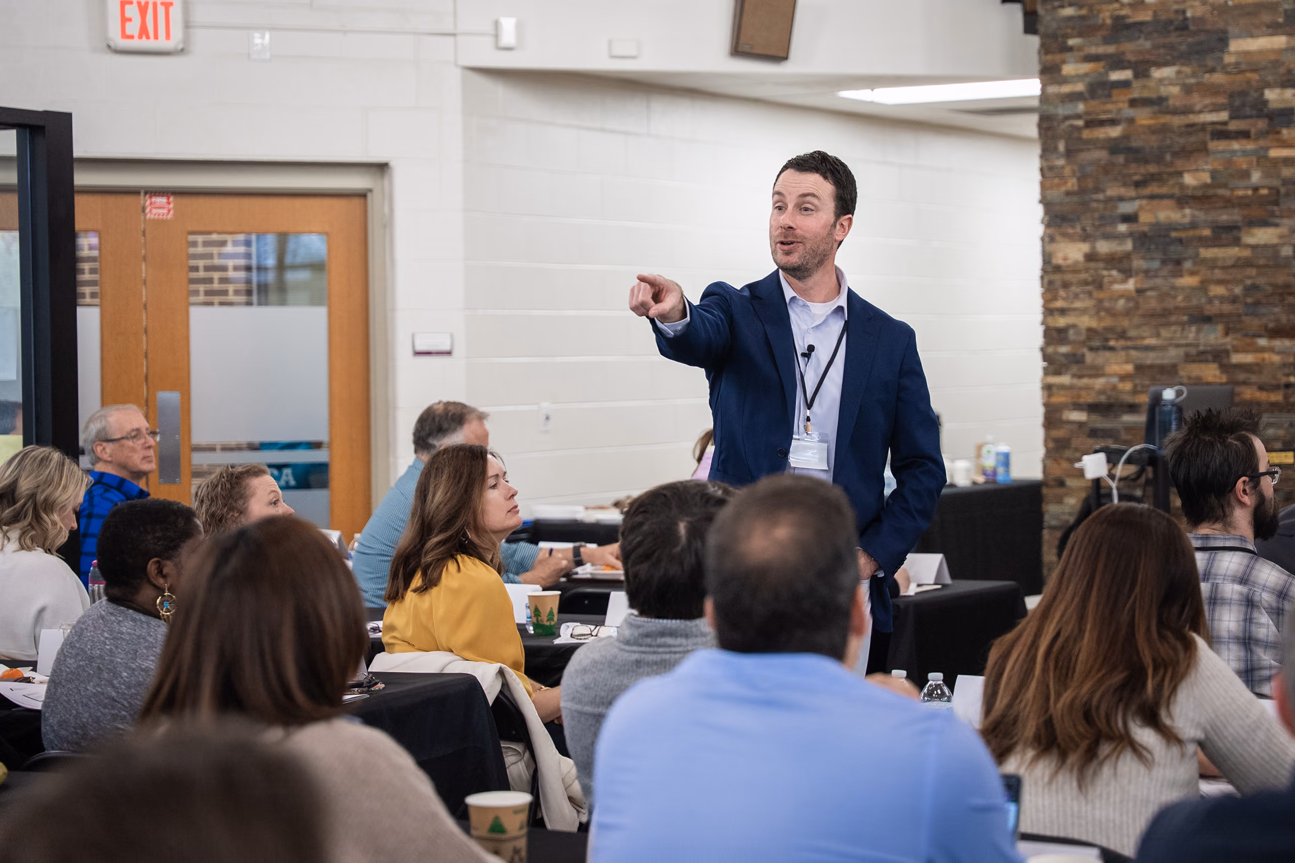 Stephen addresses a room of attendees at a SeedTree Group leadership event