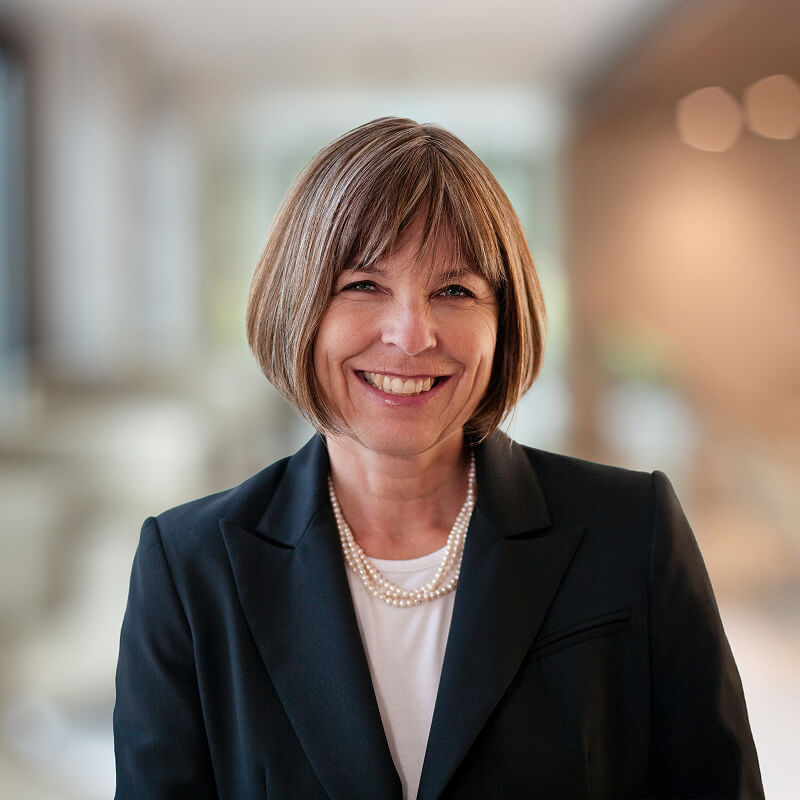 Smiling woman wearing blue blazer