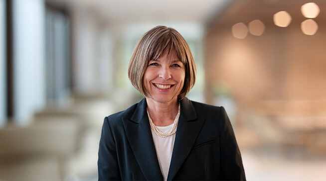Smiling woman wearing blue blazer
