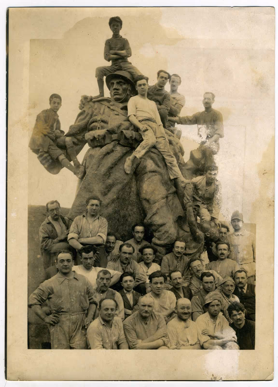 Battaglia artisans in the 1930s photographed with a soldier sculpture.