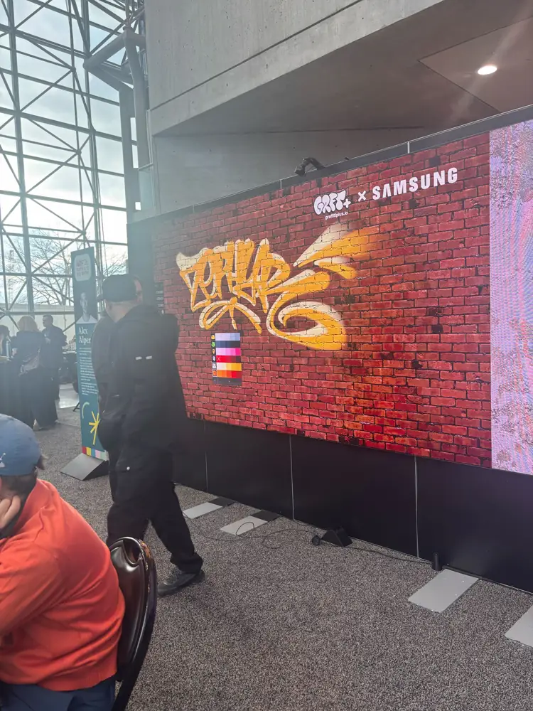 A large LED wall showing digital graffiti in a Graffiti+ and Samsung installation