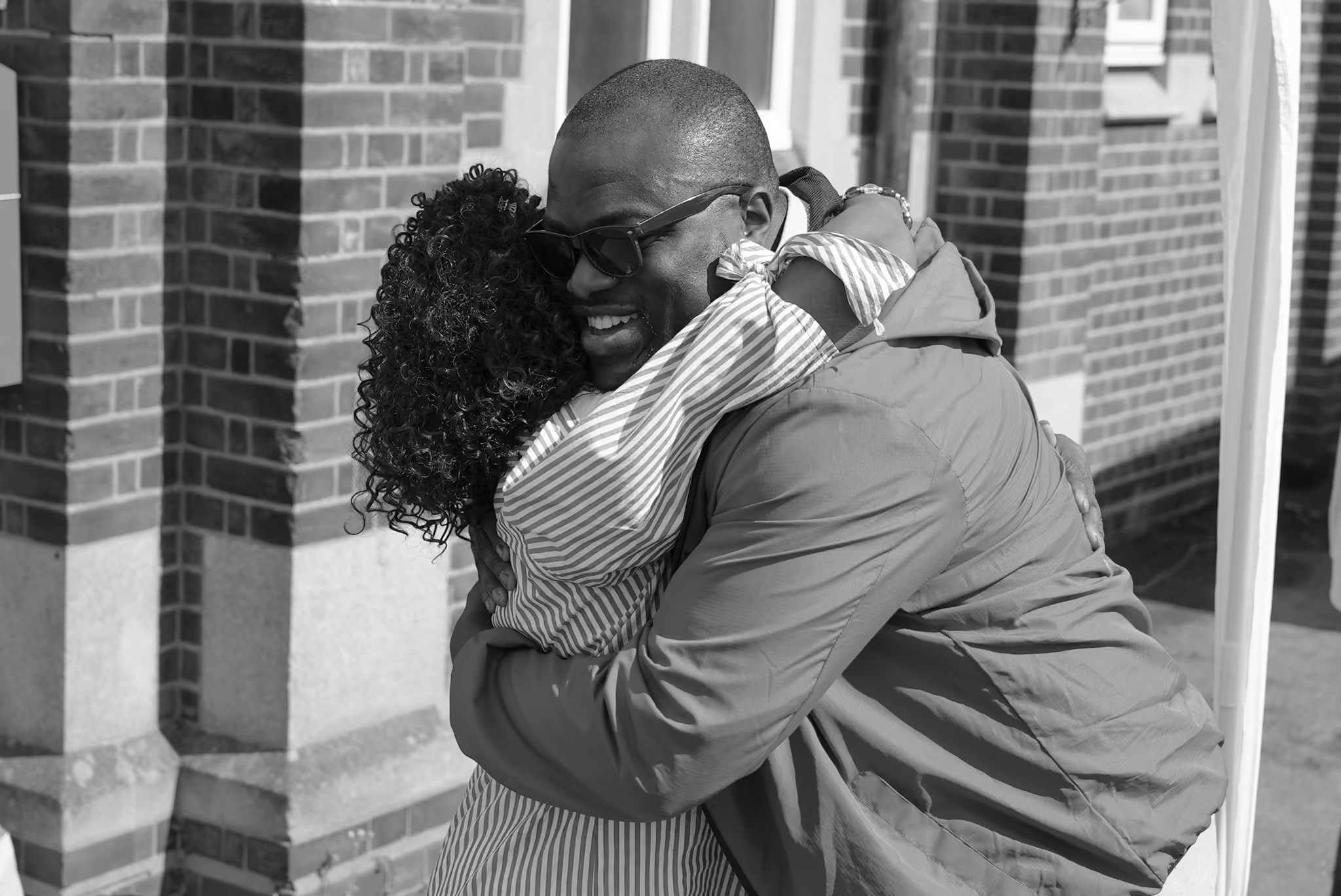 Members embracing warmly at Elpis Christian Ministries, Ilford