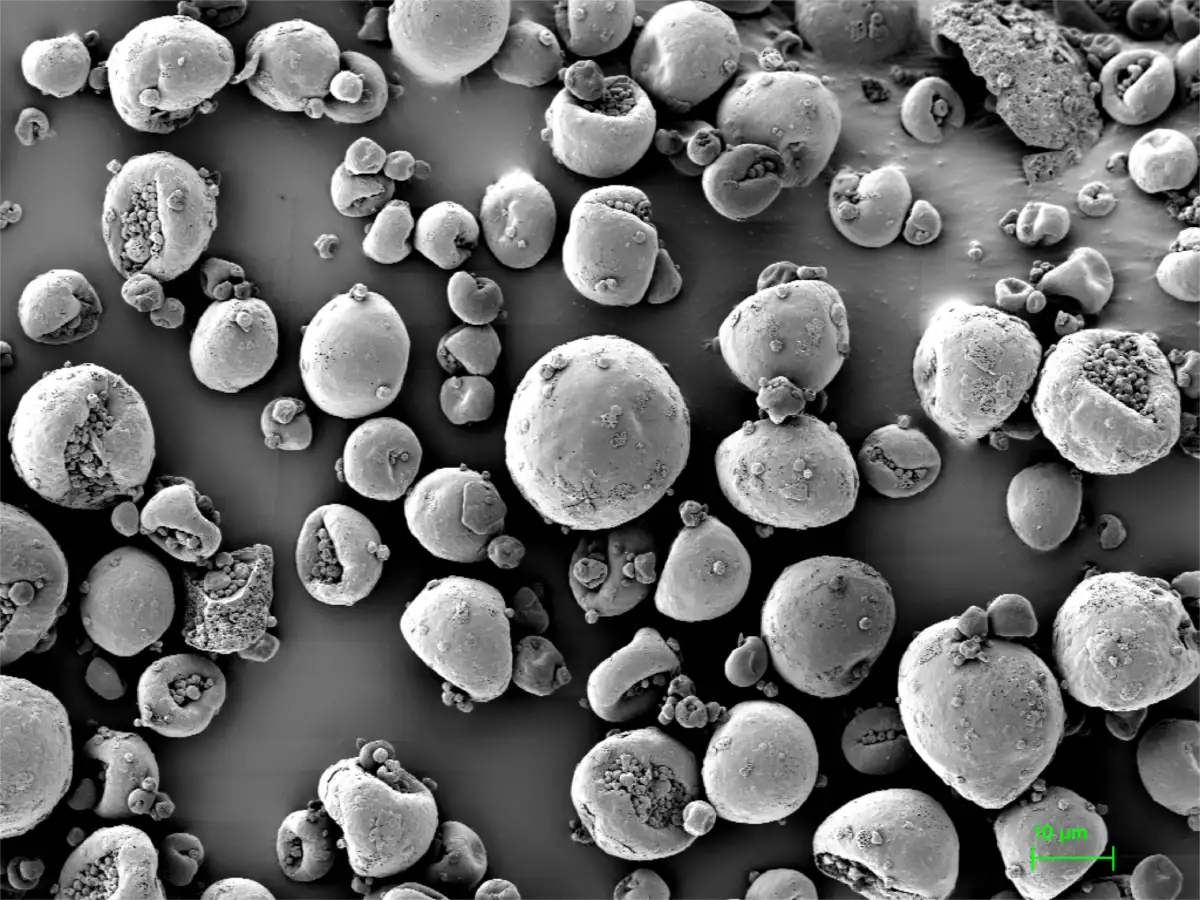 Spray dried dispersion microstructure background image showing amorphous particle morphology