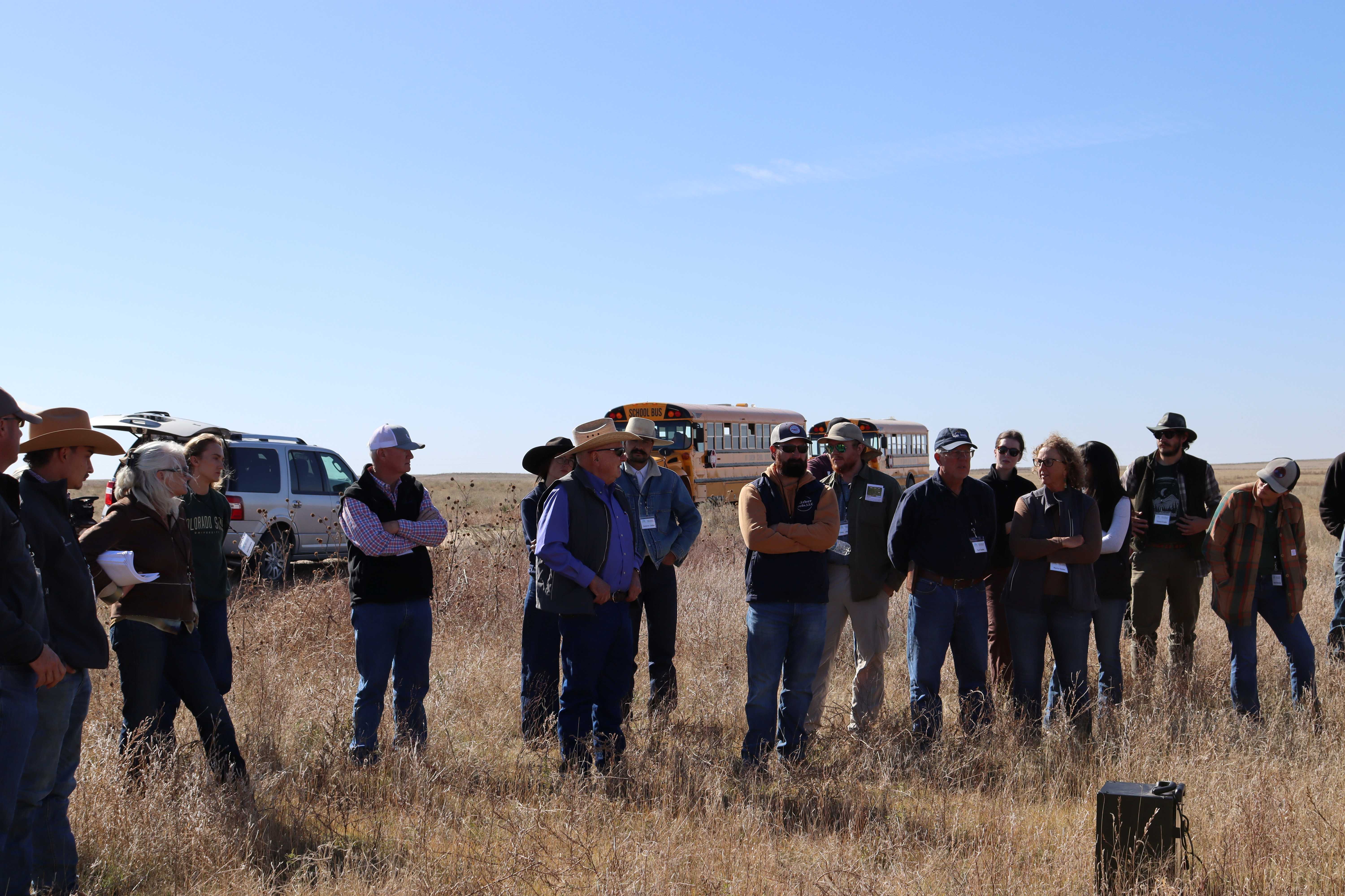 A crowd attends a ranching field day.