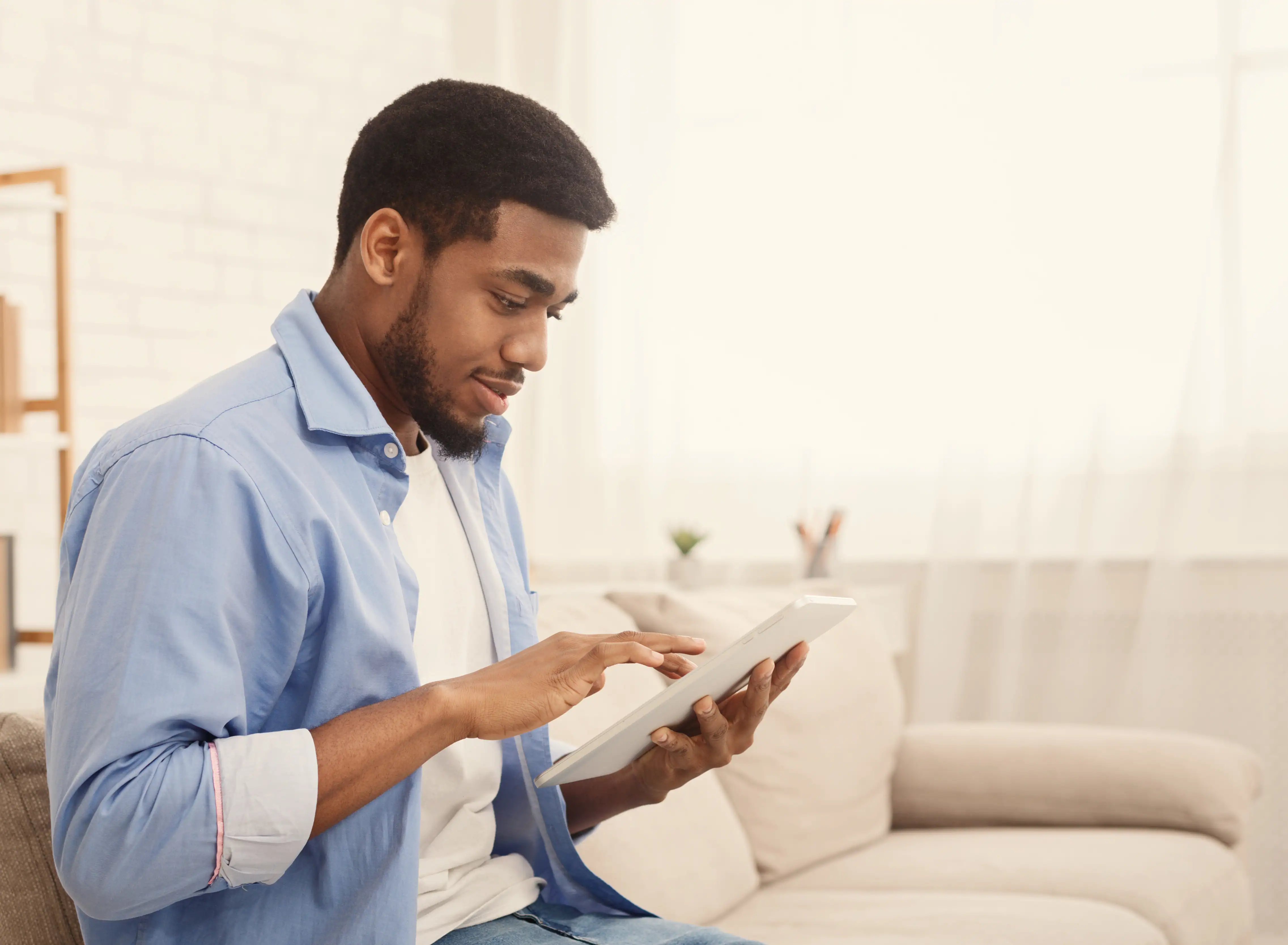 Remote therapeutic monitoring patient inputs patient-reported outcome data into tablet.