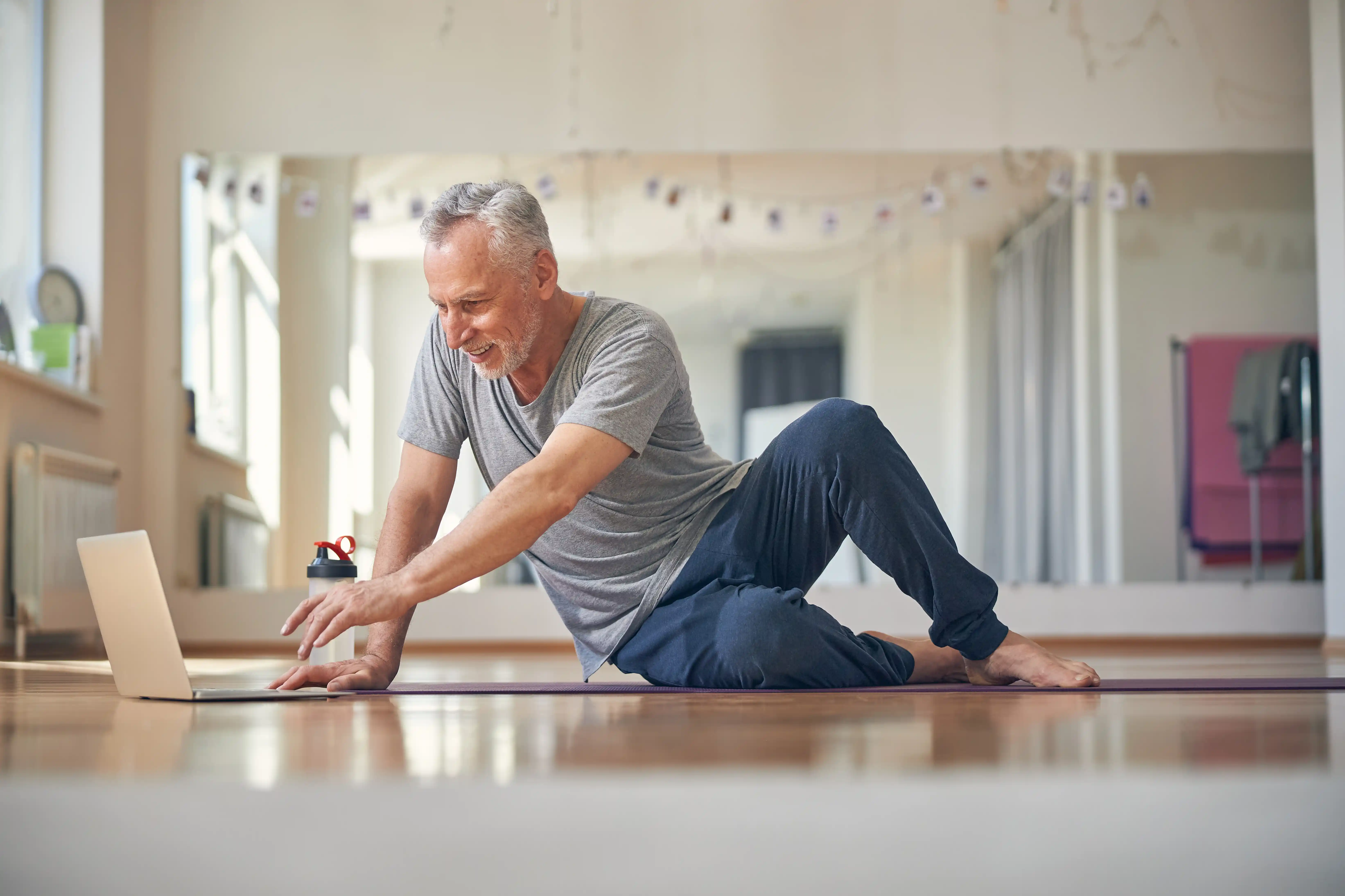 Low back pain patient participates in preventive care measures under ambulatory specialty model goals.