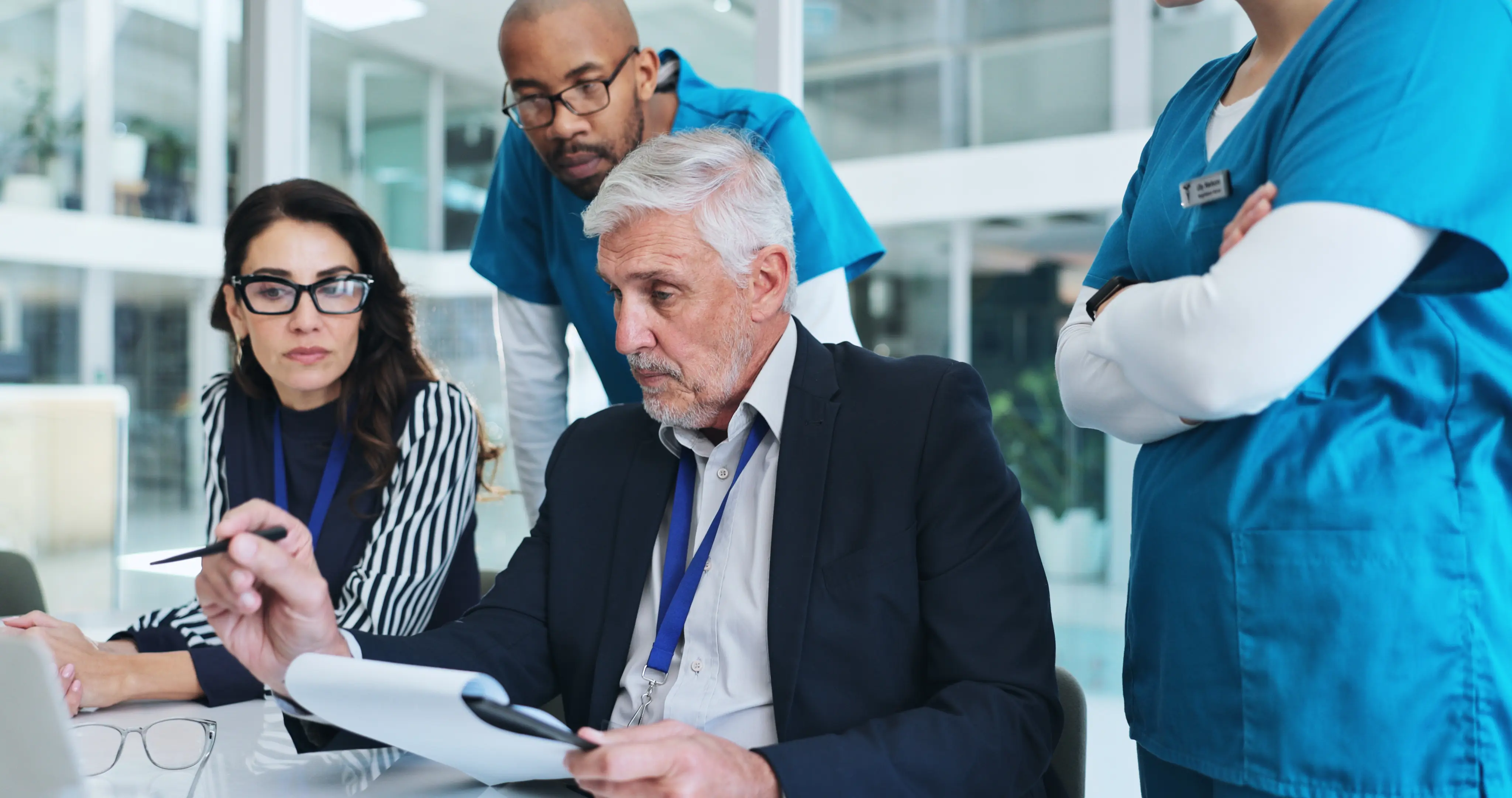 Hospital executives, quality leaders, navigators, and nurses discussing performance on Transforming Episode Accountability Model (TEAM) cost and quality measures.