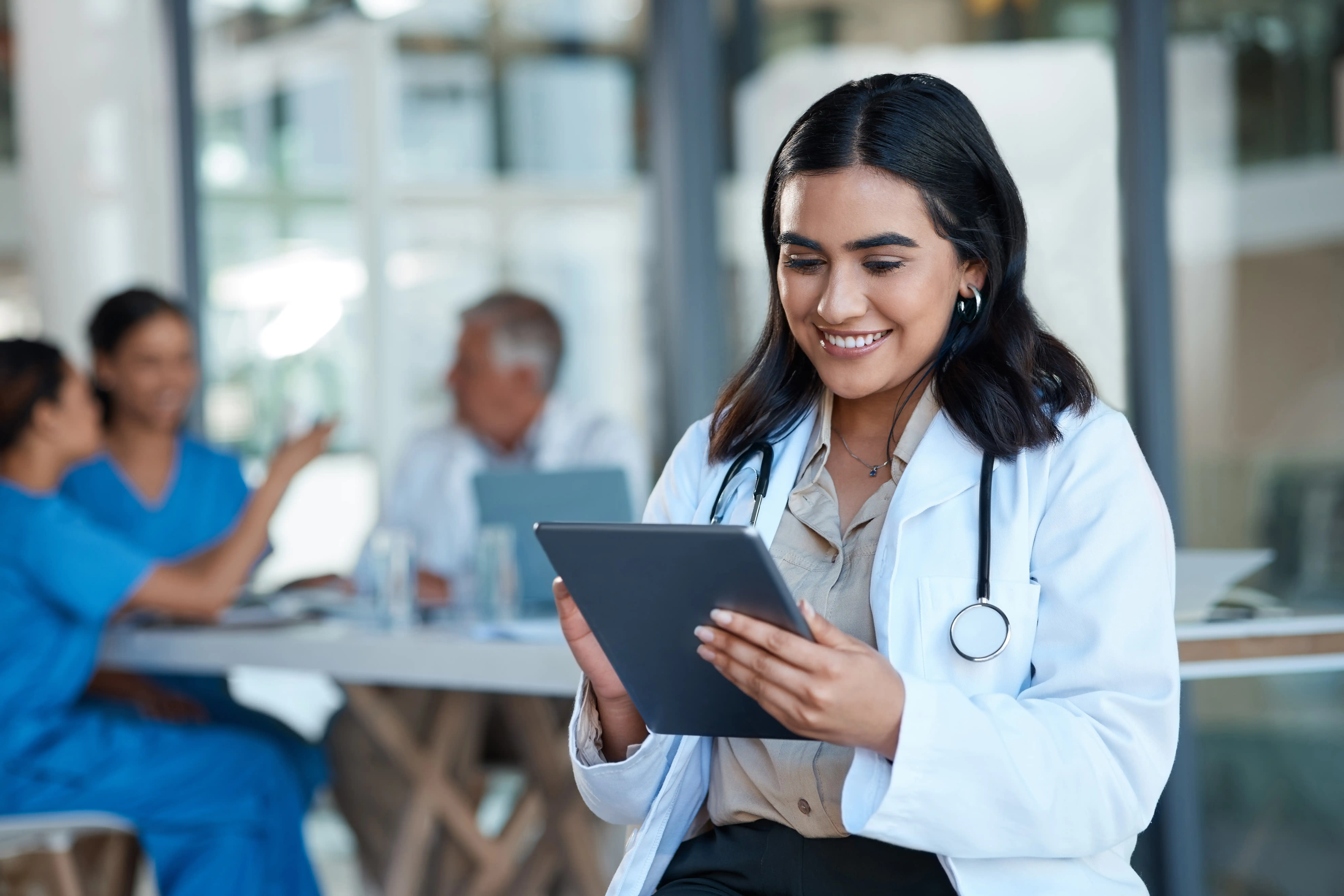 Healthcare provider using tablet to access patient data on Force Therapeutics.