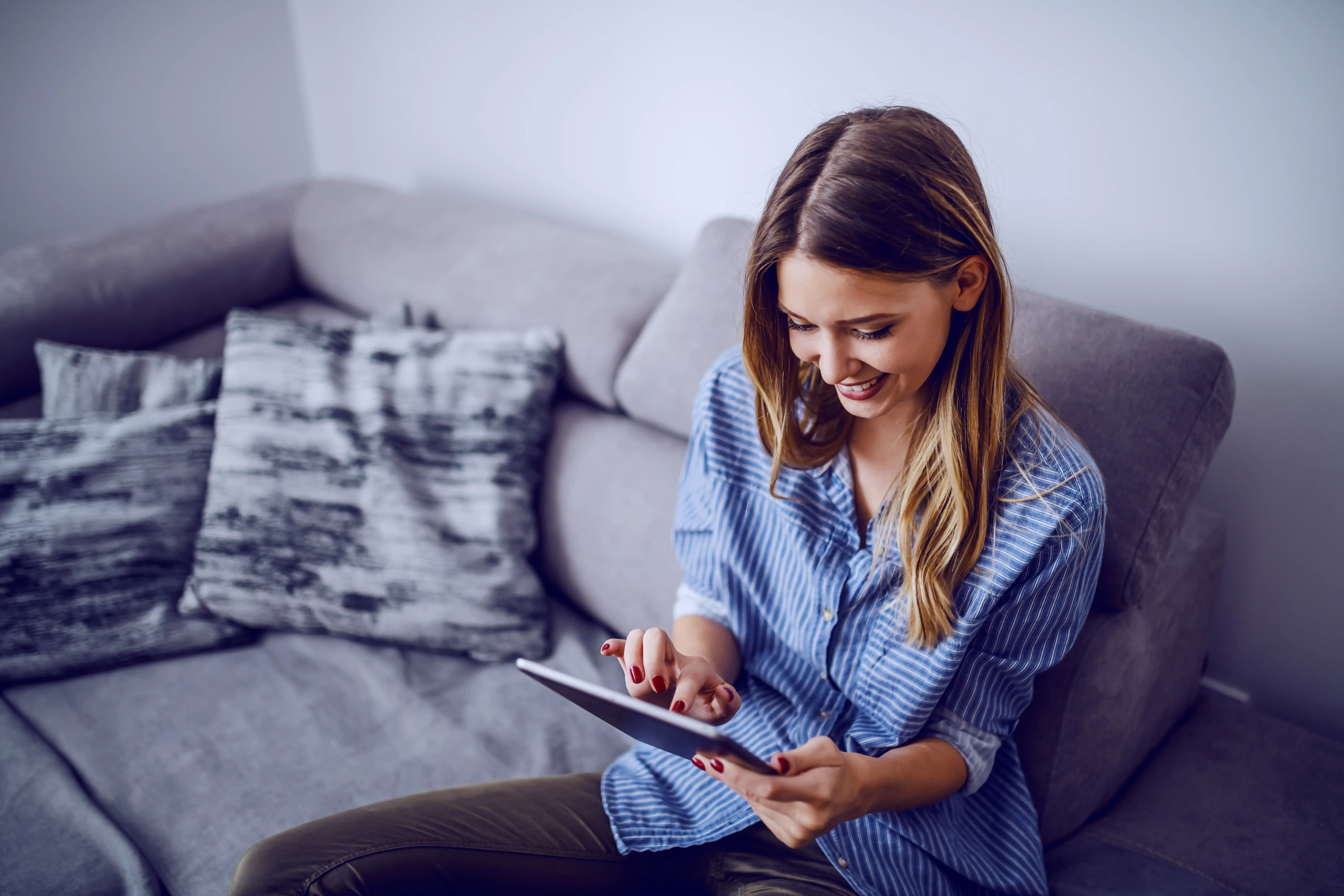 Person completing PROMs digitally through Force Therapeutics tablet application from home.