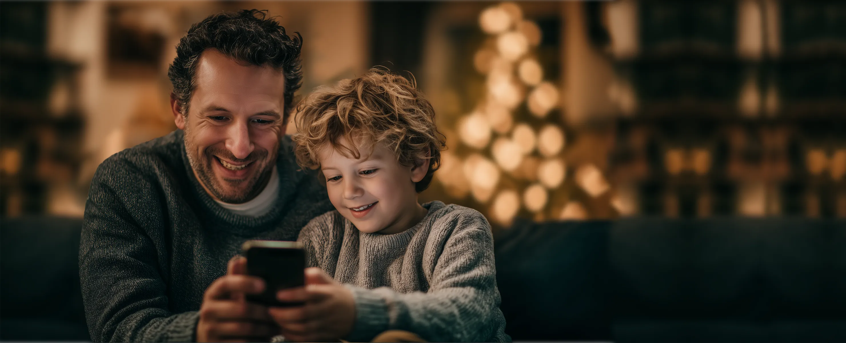 Happy Father using tasa.app with is son next to him