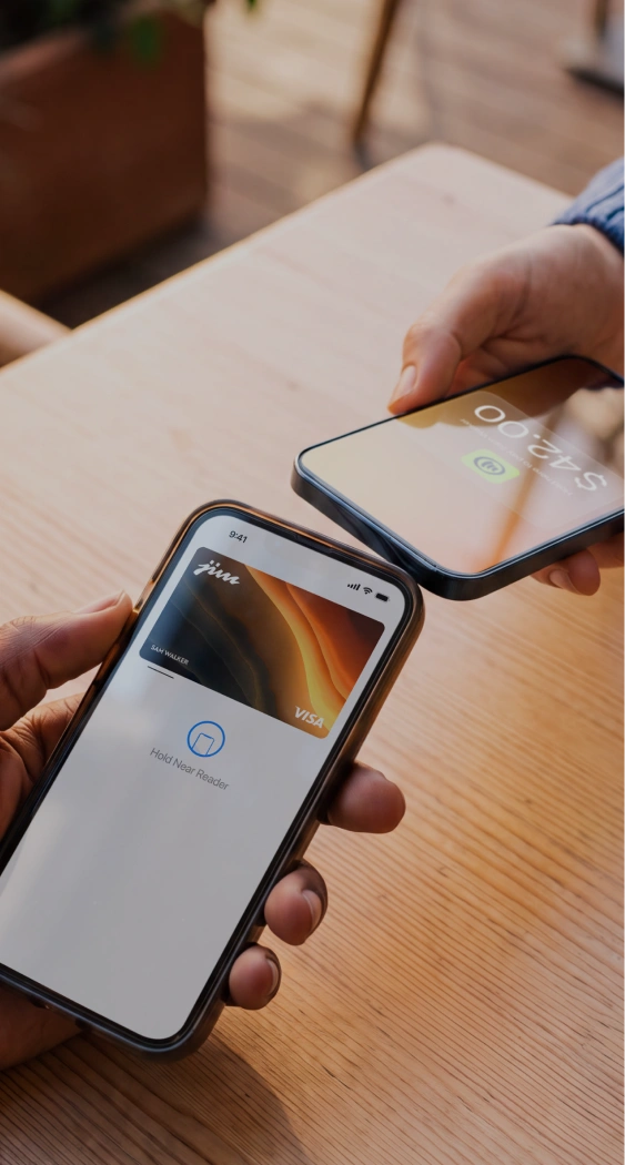 Jim Visa card tap-to-pay between two phones showing $42.00 at cafe