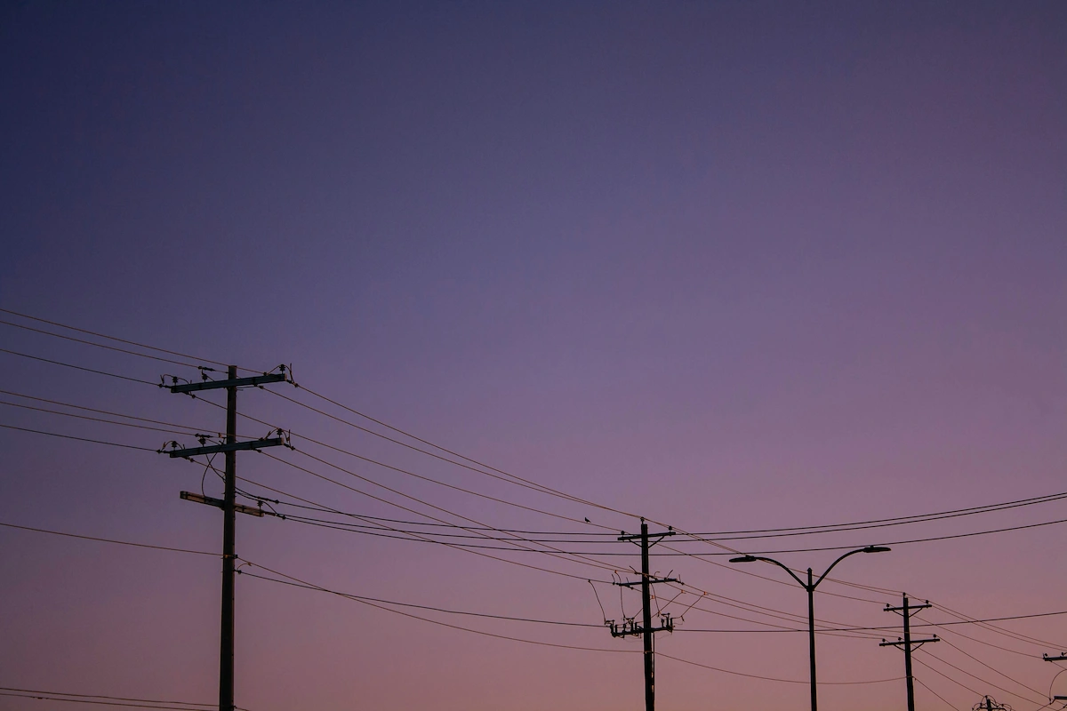 Electric power lines at sunset