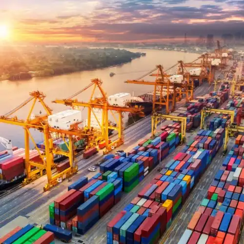 Cargo containers and cranes operating at a major shipping port.