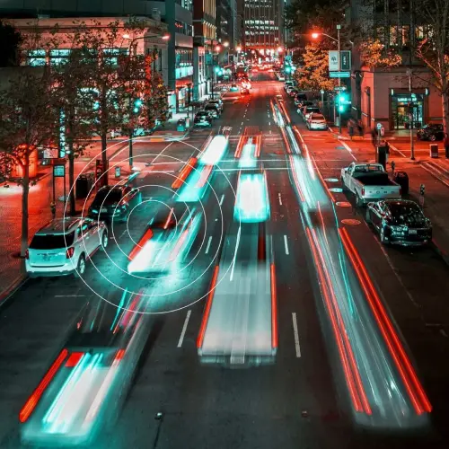 Smart city traffic monitoring system visualizing vehicle movement on a busy urban street.