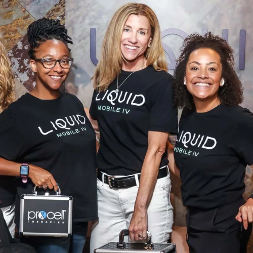Liquid Mobile IV team members posing with mobile healthcare equipment.