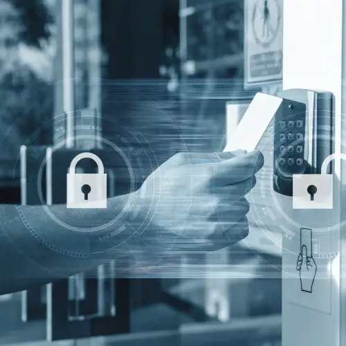 Close-up of a person presenting a keycard for secure building entry and access control.