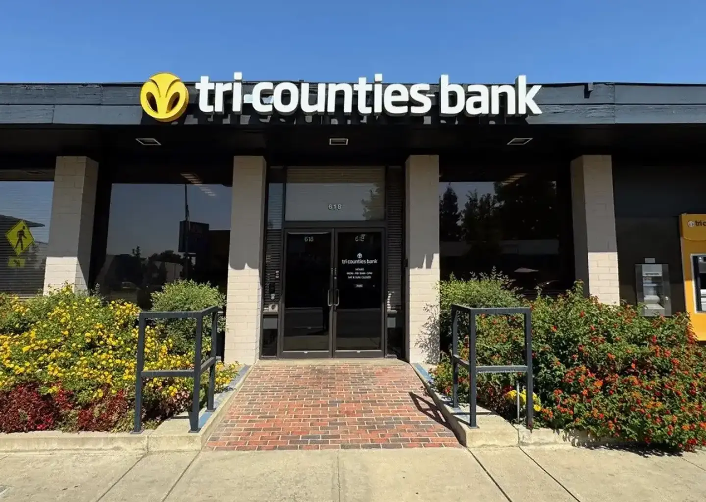 Tri Counties Bank branch entrance with company signage.