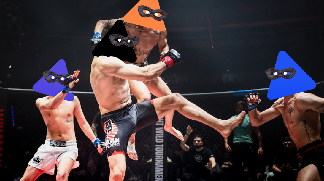 Image of a boxe ring with four boxers battling. They all have facemasks of the MIA mascot the nacho.