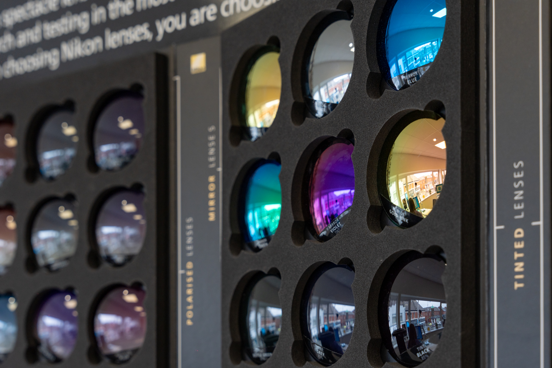 Display of colorful tinted camera lens filters in various shades