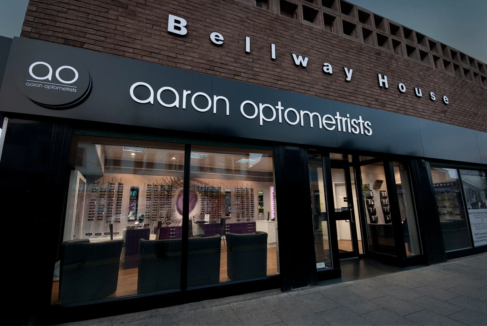 Qaron Optometrists storefront with eyeglasses display in Bellway House