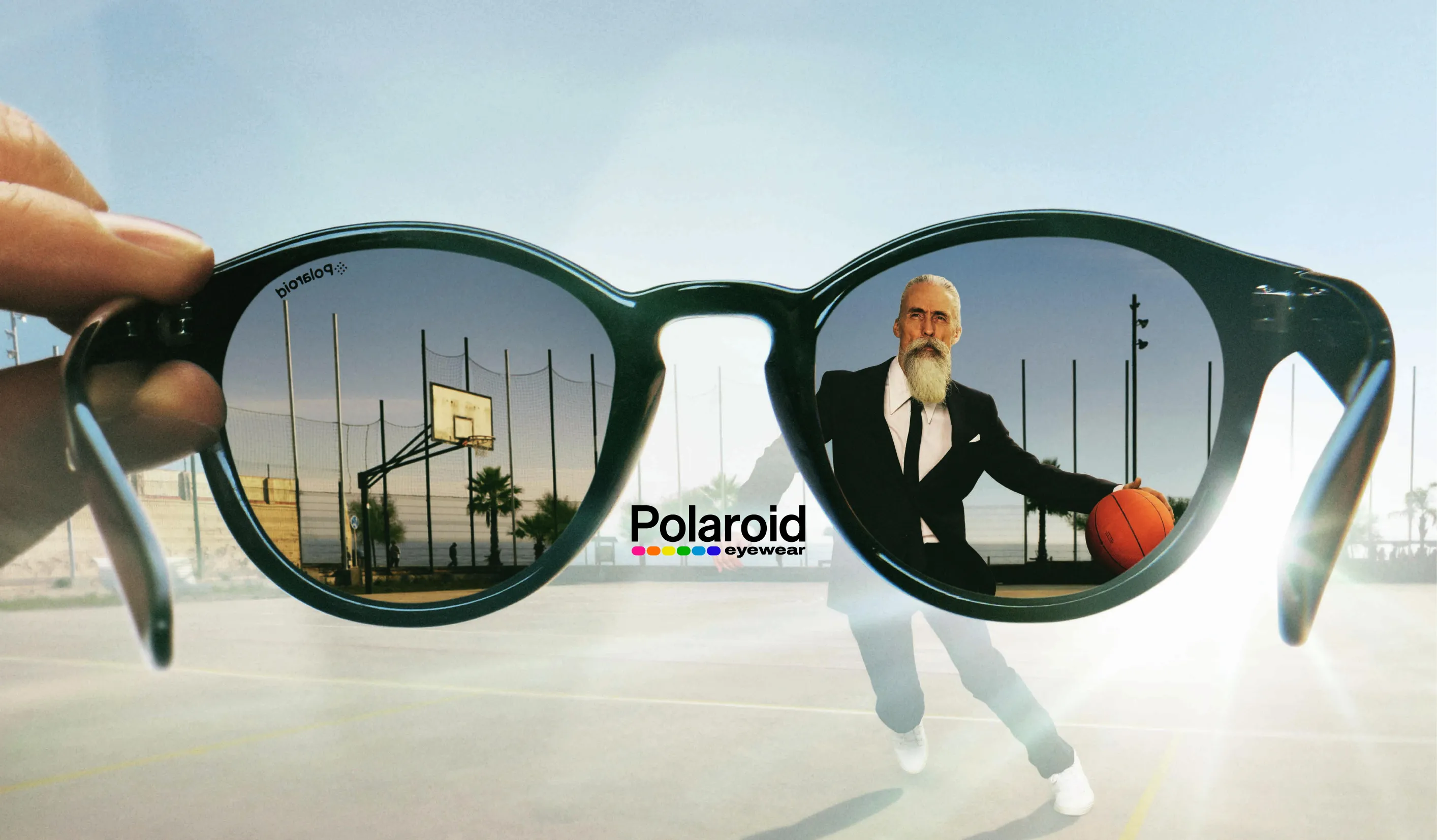 Polaroid sunglasses showing basketball court and stylish older man with ball